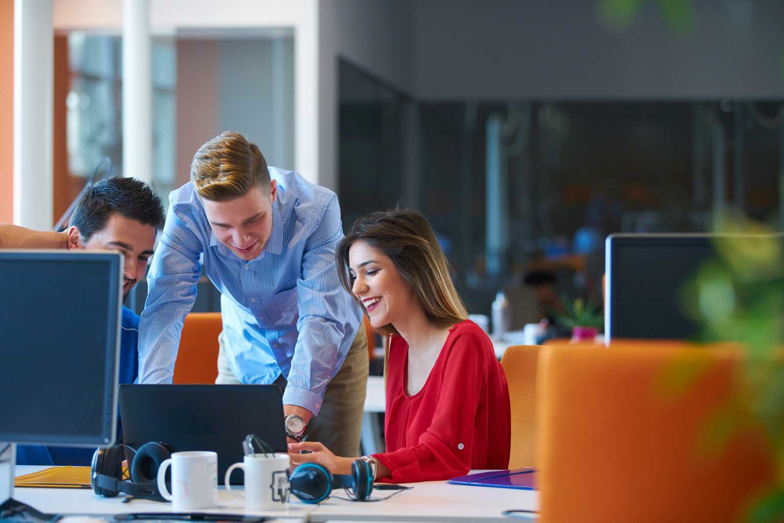 People working in office co-working space